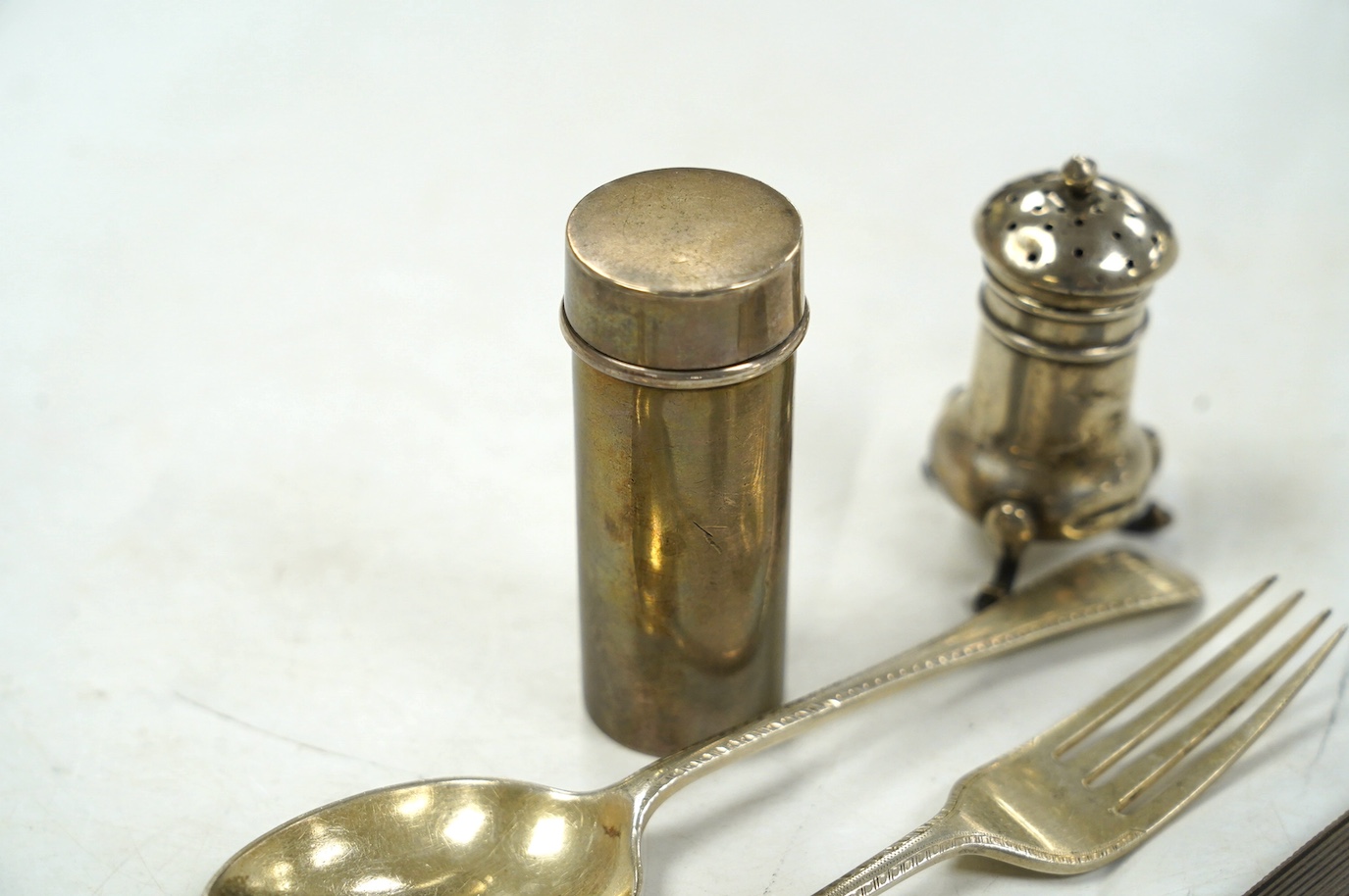 A group of small silver, including a George IV vinaigrette, shaving brush holder, etc. and a Dutch white metal snuff box. Condition - poor to fair